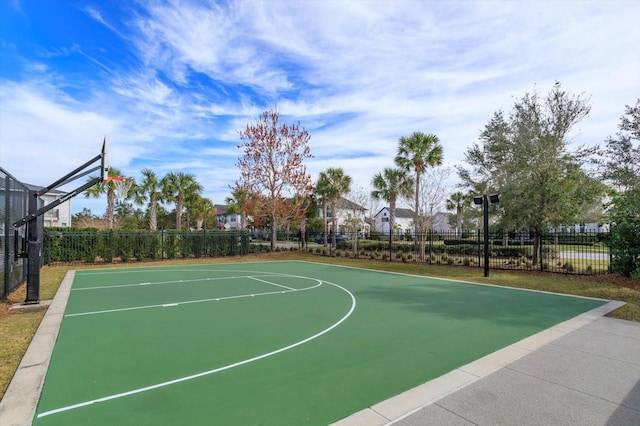 view of basketball court with community basketball court and fence