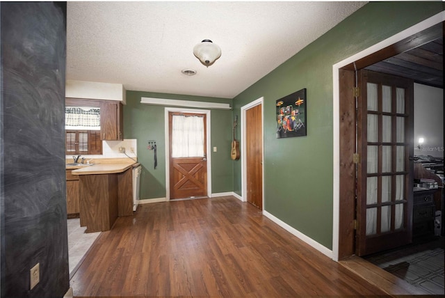 tiled foyer with sink