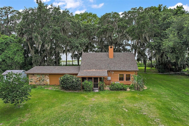 back of house with a yard