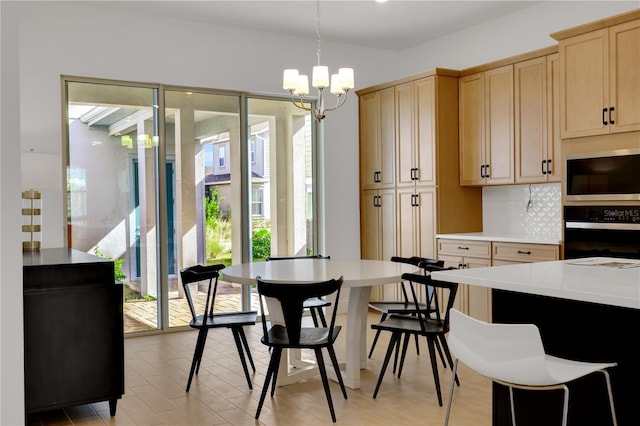 dining space with a notable chandelier