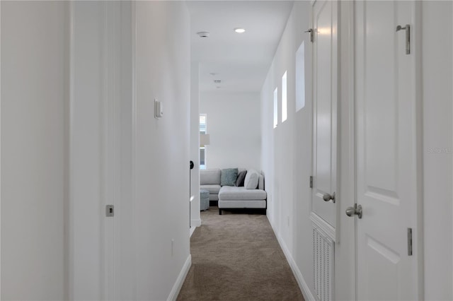 corridor featuring carpet flooring