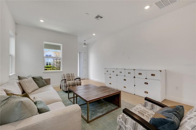 living room with light hardwood / wood-style flooring