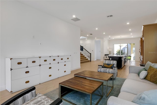 living room with light hardwood / wood-style floors