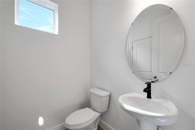 bathroom with toilet and sink