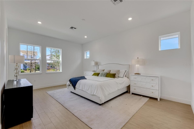 bedroom with light hardwood / wood-style flooring