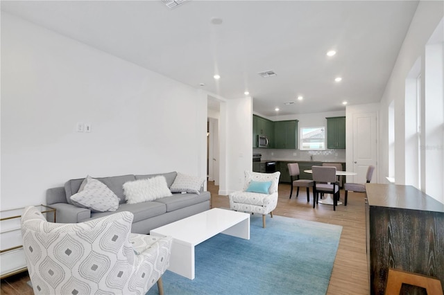 living room featuring light hardwood / wood-style floors