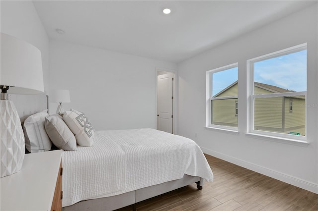 bedroom featuring wood-type flooring