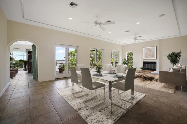 tiled dining space featuring ceiling fan