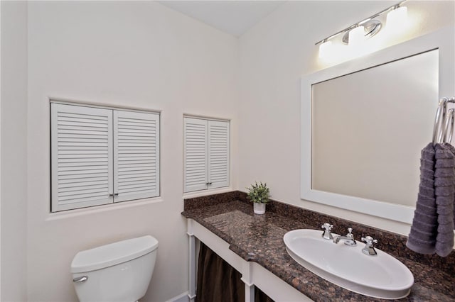 bathroom with oversized vanity and toilet