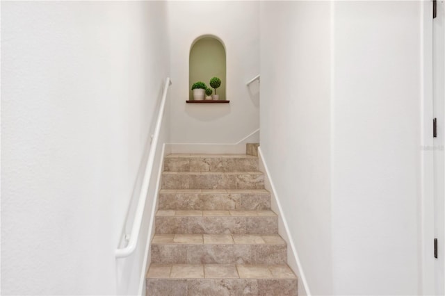 stairs featuring tile floors