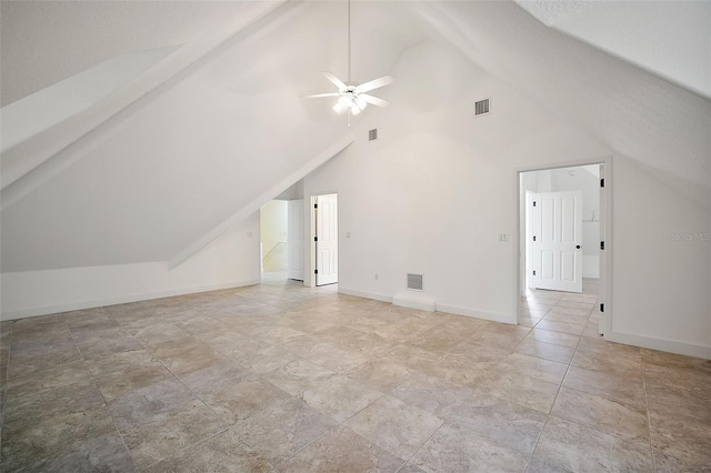 bonus room with light tile flooring, ceiling fan, and high vaulted ceiling