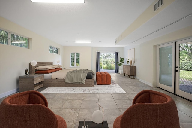 tiled bedroom with access to outside and french doors