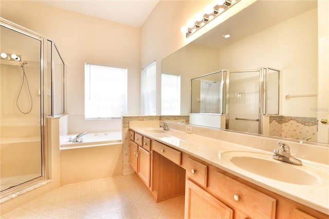 bathroom with vanity and independent shower and bath