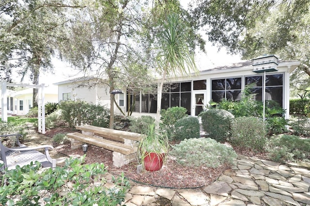 view of yard with a sunroom