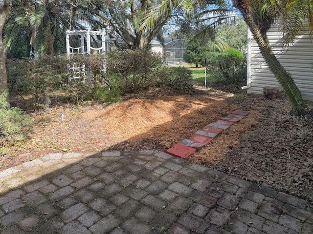 view of yard featuring glass enclosure