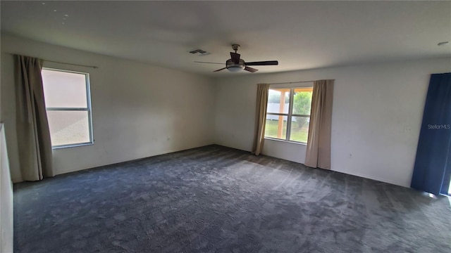 carpeted empty room with ceiling fan