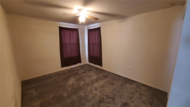 carpeted empty room featuring ceiling fan