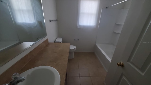 full bathroom featuring toilet, tile flooring, vanity, and shower / tub combination