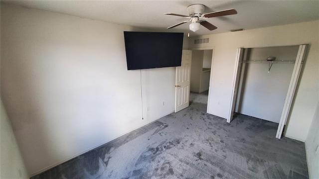 unfurnished bedroom featuring a closet, carpet flooring, and ceiling fan