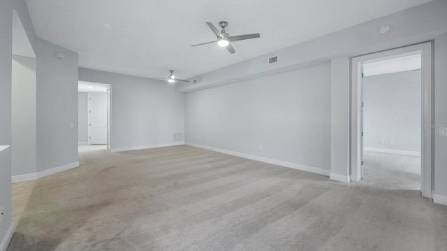 carpeted empty room with ceiling fan