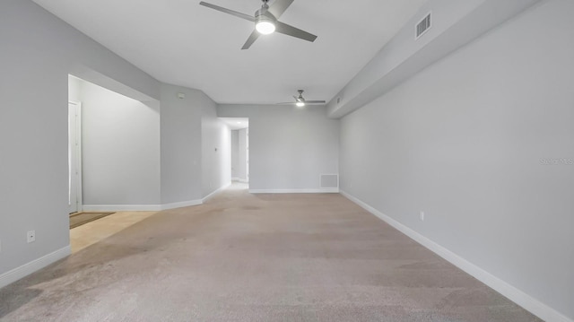 carpeted empty room with ceiling fan