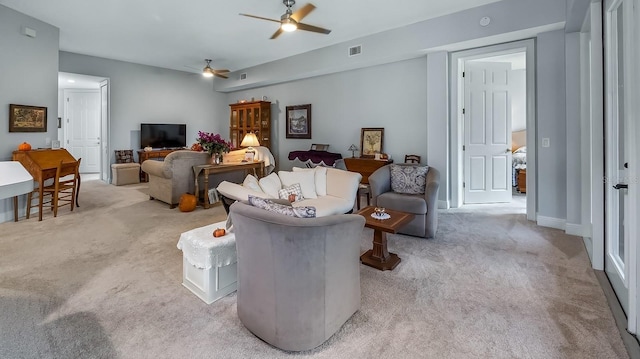 living room featuring light colored carpet and ceiling fan