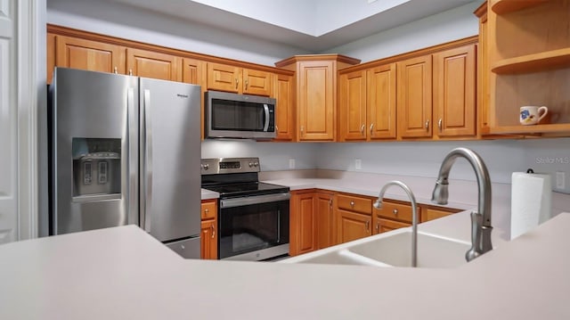 kitchen with appliances with stainless steel finishes and sink