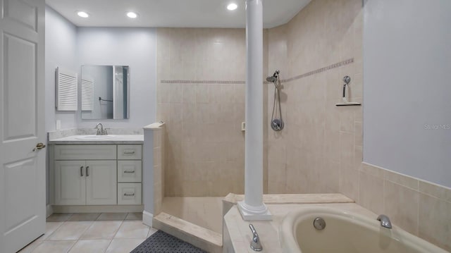 bathroom with vanity, shower with separate bathtub, and tile patterned flooring