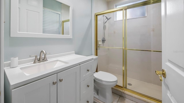 bathroom featuring vanity, an enclosed shower, tile patterned floors, and toilet