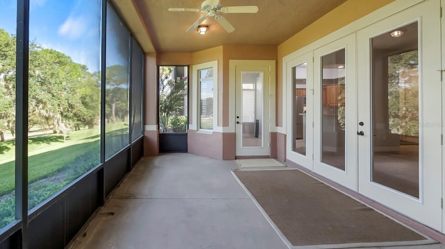 unfurnished sunroom with french doors and ceiling fan