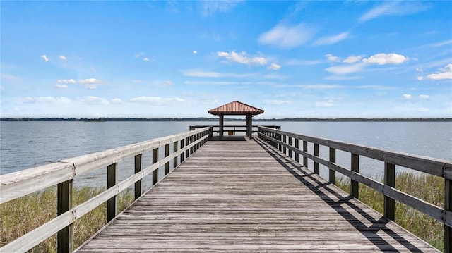 view of dock featuring a water view and a gazebo