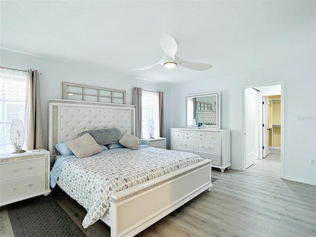 bedroom featuring ceiling fan and light wood-type flooring