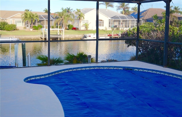 view of pool with a water view