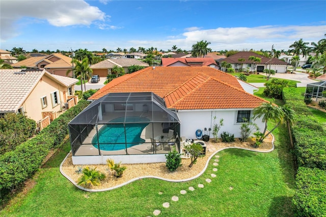 exterior space with a lawn and a lanai