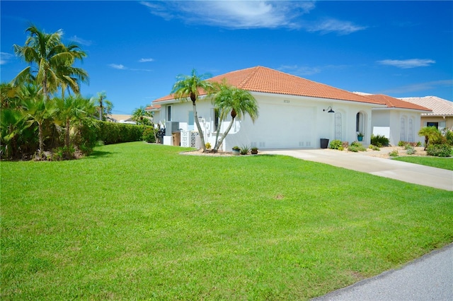 view of side of property with a lawn