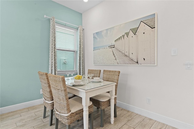 dining space with light hardwood / wood-style flooring