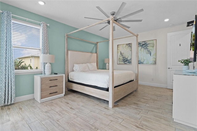 bedroom with ceiling fan and light wood-type flooring