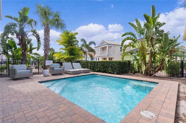 view of swimming pool featuring a patio area