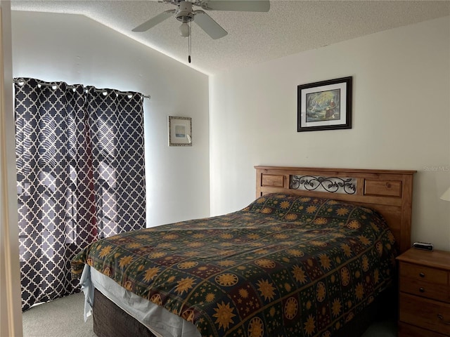 bedroom with a textured ceiling, carpet, vaulted ceiling, and ceiling fan