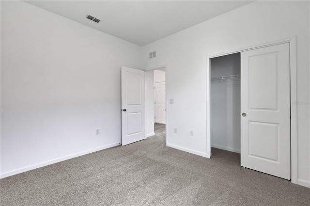 unfurnished bedroom featuring a closet and carpet floors