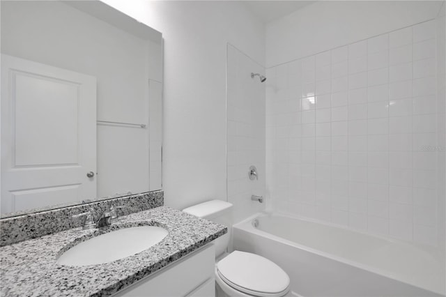 full bathroom featuring vanity, toilet, and tiled shower / bath