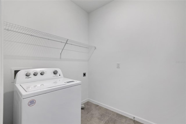 washroom with light tile patterned floors and washer / dryer