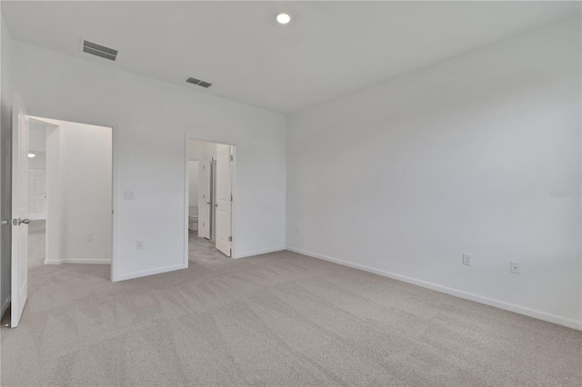 unfurnished bedroom featuring light carpet