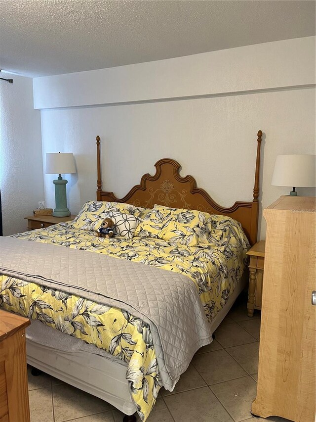 bedroom featuring light tile patterned flooring