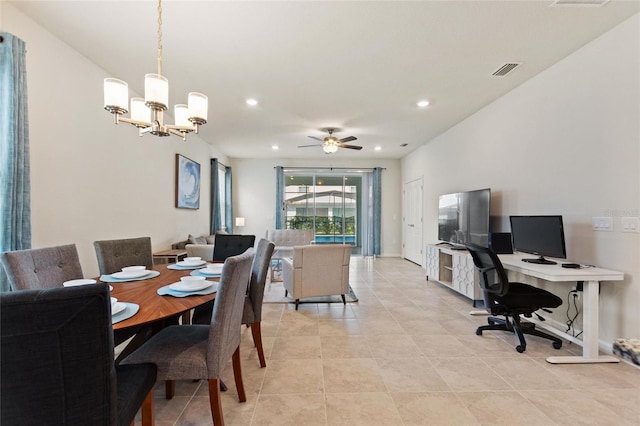 tiled dining space with ceiling fan with notable chandelier