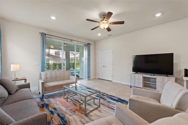 tiled living room with ceiling fan