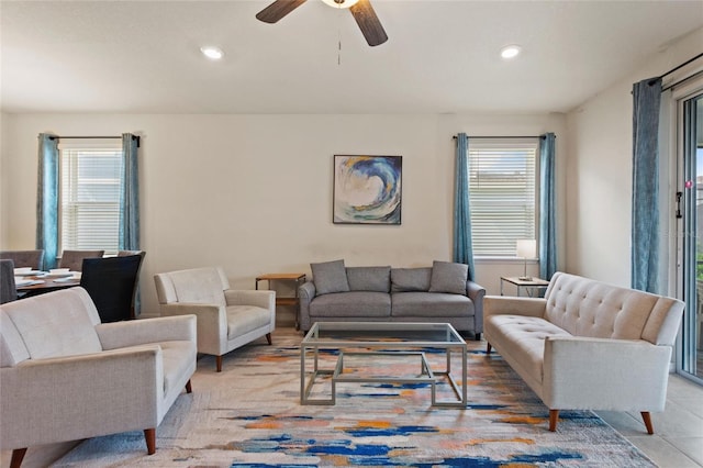 tiled living room with ceiling fan