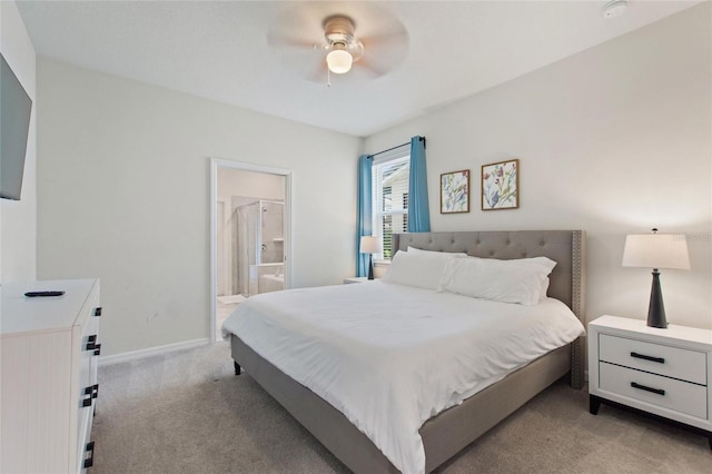 carpeted bedroom featuring ensuite bathroom and ceiling fan