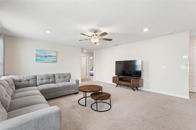 carpeted living room featuring ceiling fan