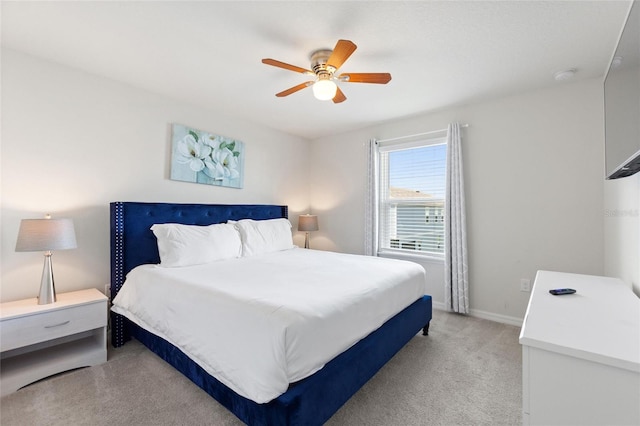 bedroom featuring light colored carpet and ceiling fan